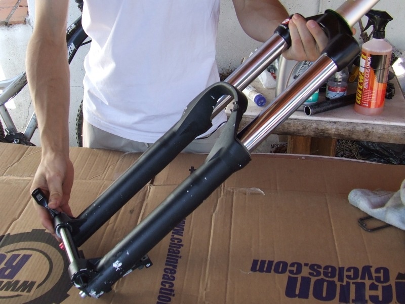 <span style='font-size:20px'>Step 1.</span> Remove the front wheel and brake caliper, then remove the fork from the bike.