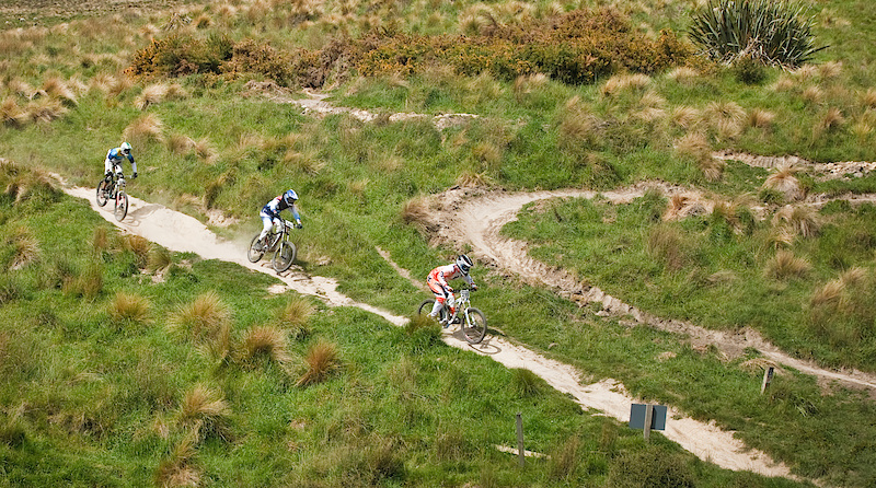 James Rennie leads two other riders down the fast, rough and rutted 'flow' section just after the halfway mark.