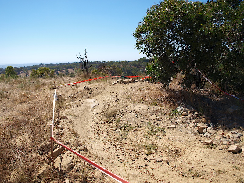 Riders come off the ridge at this right hand corner before traversing across the face of the hill.