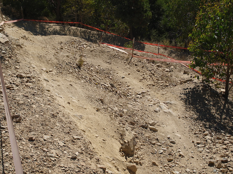 The next section sees the riders perform a 180 degree turn. The fast line has been worn to the left of the photo up high allowing the rider to almost drop into the berm.