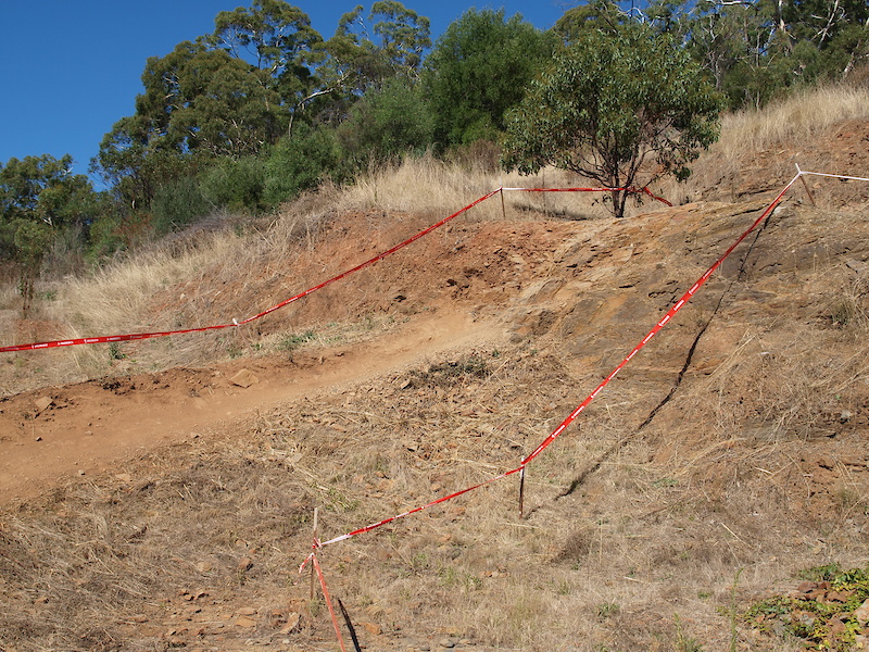 The next challenge on the track for riders is another chute with a sweeping left hand berm at the bottom.