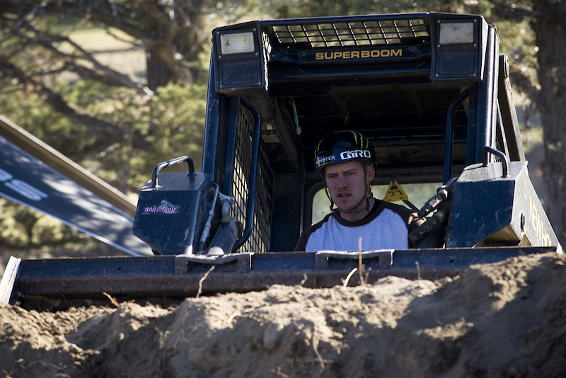 It definitely doesn't suck to have your own skid steer.. Jamie Goldman piles up the landing for the Best Trick Comp at UDUG 2011