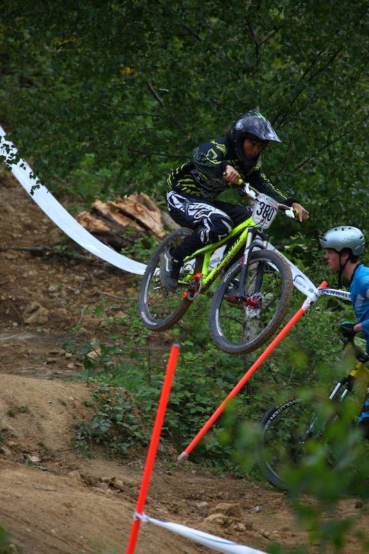 Dylan Grell-Delsol hitting the road gap at the bottom of the track, goggless, fearless, 12 years old...