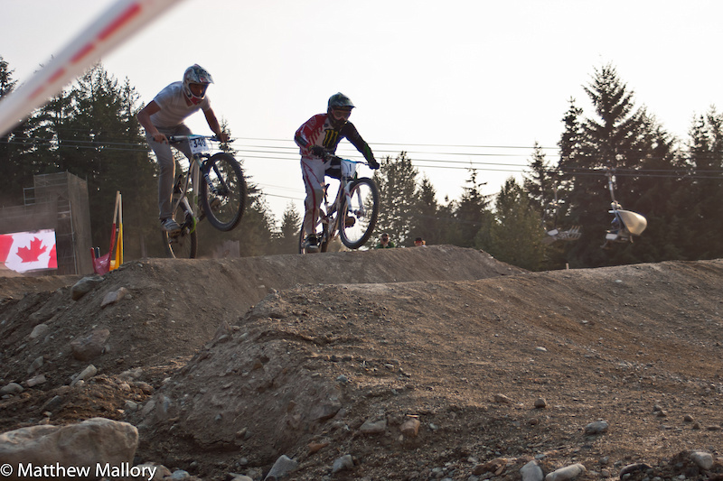 This photo illustrates one of the beauties of Crankworx. A local rider (skinny jeans) holds his own against Sam Hill on the Dual Slalom course. It is not often that you can share a track with the best in the world.