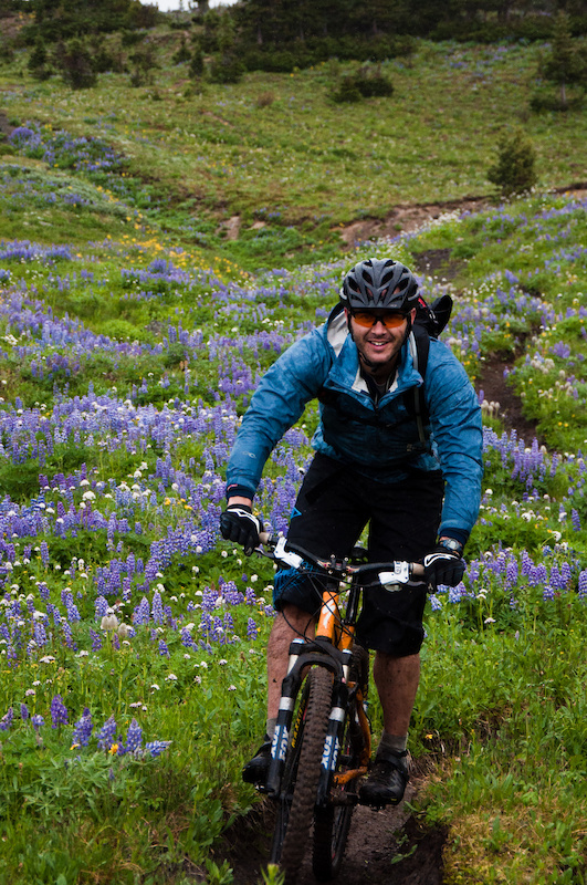 Singletrack, wild flowers and a smiling rider, what more could you ask for in an adventure? Now get out there and create your own trip.