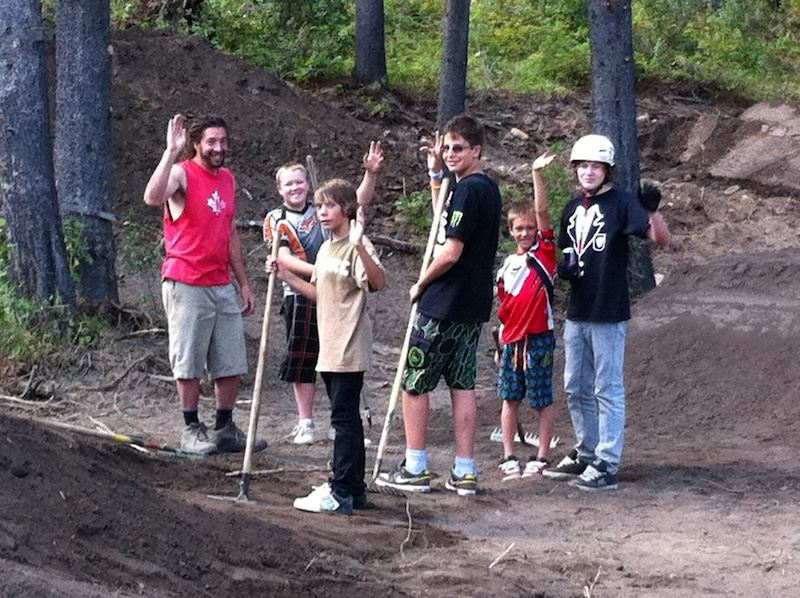 Jay Hoots shaping dirt jumps with the local kids