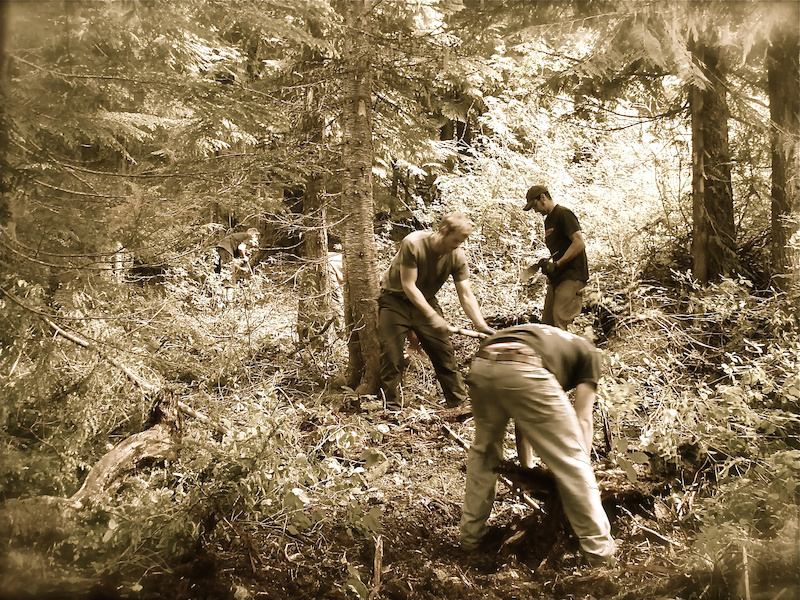 A little blood, lots of sweat, and a few beers: the trail crew putting in a hard day's work.