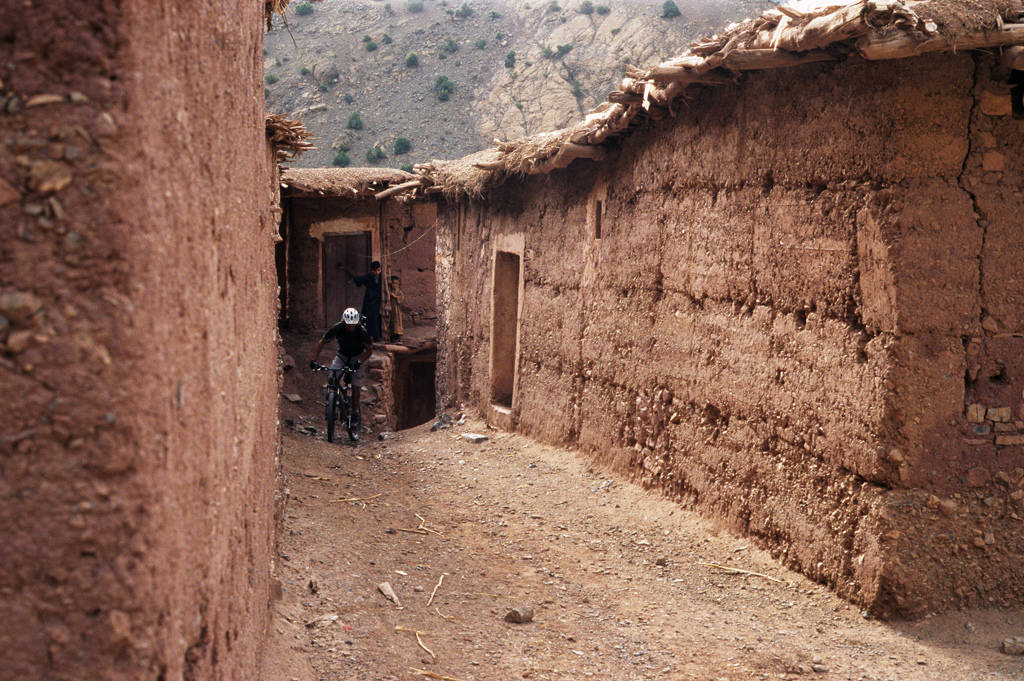 <span style='font-size:12px'>Out in the open it's easy to spot the trail. Once we entered a village, no matter how small we were at the mercy of our sense of direction to get us through the maze of alleyways. It didn't always work, needing some backtracking to the astonishment of local goat herders at times.</span><br><br>At the last village before the final push our arrival is greeted by running kids all shouting the now familiar phrase