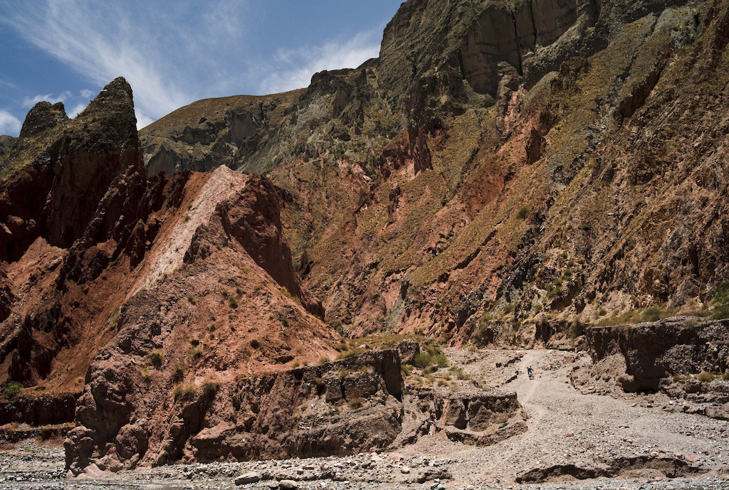 <span style='font-size:12px'>Trails like this near Iruya are normally highways for hooves. We watched a dozen different horsemen descend from the precipitous canyon edge high above, emerging on this trail that we explored. If you fancy the hike, there is plenty of technical and exposed switchback-laden singletrack scarring the canyon walls around this one village alone.</span><br><br>Argentina is an extremely big country, 11 times the size of the UK in fact, but it has a population of only 40 million, almost a third of which live in or around its sprawling capital. That means of course, vast tracks of land that are largely uninhabited and a lot of wilderness to explore including some of its 16 national parks. We chose Los Cardones park to start our bike adventure after which we'd head South and then up North again tracing an inebriated figure-eight route around several locations that, at least on paper, seemed like promising riding spots. All we need is a little more info on trails. The tourist office in Salta, the regional capital, however has no idea of mountain biking by today's standards, and directs us to some scenic dirt roads we 'might like to ride'. The guy at the car rental agency, though is a little more clued up and as we climb into our cheap, but impractically small rental Chevy Corsa he thrusts a hand drawn map into my hand. It's like those pirate maps you used to draw as a kid; a spidery scrawl of squiggly lines and vague directions to buried treasures littered around the region, a tour of which will mean driving about a thousand miles to complete. Having led sight-seeing excursions for years he's noted a fair few 'secret' spots too; information you won't find in the tourist office and we vow, like obedient kids, to guard the map with our lives. We leave Salta behind and steer the car, it's back seat and boot now crammed with 2 dismantled bikes and luggage, towards the town of Cachi a four hour drive to the West.