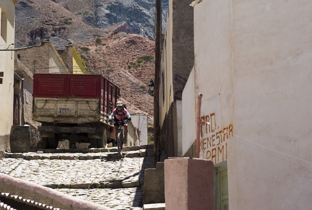 <span style='font-size:12px'>Nothing beats a blast back down into the village after a 1300 m descent. Iruya is cut off from the rest of Argentina by a 4000m+ pass. Grab a local bus ride shuttle up to it to find some decent trails back to town. Just don't worry when the driver raises an eyebrow at the idea of dropping you off at the top.</span><br><br>Despite having spent some time in Argentina previously, the desert North of this long and varied country has always escaped my attention. I never worked out why it remained elusive, perhaps it was the challenge of getting there (it's an 18 hour bus ride from the capital Buenos Aires) or competition for my attention from the familiarity of green mountains in the south, but either way this region looked worth a visit from what I could see during a bit of armchair web-surfing. My laptop screen had been swamped with the kind of pictures you might expect to crop up in Neil Armstrong's photo album; oddly shaped pinnacles of red rock and dusty lunar-like terrain leapt from every photo and beckoned us northwards. In Buenos Aires we paid our 60 bucks for a bus ticket and sat back to enjoy 18 hours of in-flight 'entertainment'.