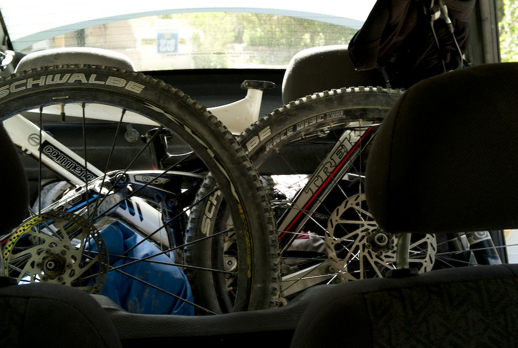 <span style='font-size:12px'>Rental cars are not always the most suitable options for carrying two bikes plus gear for a three week trip around the dusty north. But where there is a will there is a way.</span><br><br>The heat is not something I expected up at 10,000 ft on an Argentinian hillside. Ten thousand feet is the kind of altitude usually reserved for chapters in my life that involve giddy forays across snowy glaciers, not pedaling my bike through a dusty landscape with heat stroke snapping at my heels. I look around once more from beneath the slither of shade afforded by my E2's peak, and realize we are adrift in a sea of cacti. It's the sort of vegetation that usually gives a nod to what kind of temperature to expect, but for some reason I never expected it to be this damn hot. We pedal on, sweating as we go and winding our way between behemoths of the cactus world and across dry streambeds whose swathes of sand snatch at our front wheels. Twenty minutes in and I am almost relieved when the dirt track we're following leads to a dead end marked by a smallholding complete with an almost mandatory barking dog. It's a cluster of adobe houses each sealing off from the heat of the day by a thick cactus-wood door. The cul-de-sac gives us the excuse to spin around and head back to the rental car we left melting by the highway, vowing to return next day at an earlier hour when the temperature gauge is not pushing