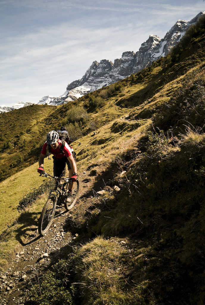 We're fettle-free (almost) and on the way by 10 a.m. sloshing alongside the river and hoiking front wheels over swollen puddles.  We roll into Montriond and find the start of trail and set off along a gently climbing, beautiful singletrack that potters between autumnal beech trees. The heavy rain of the previous night has coated every rooty section with Teflon it seems, a quality that when combined with the off camber aspect of the trail renders staying upright almost impossible.  We challenge ourselves to clean each section, but secretly, inside each of us wants to get shot of all this nonsense and get on with the ride proper. It's 11:30 and we've only covered about 3 miles.