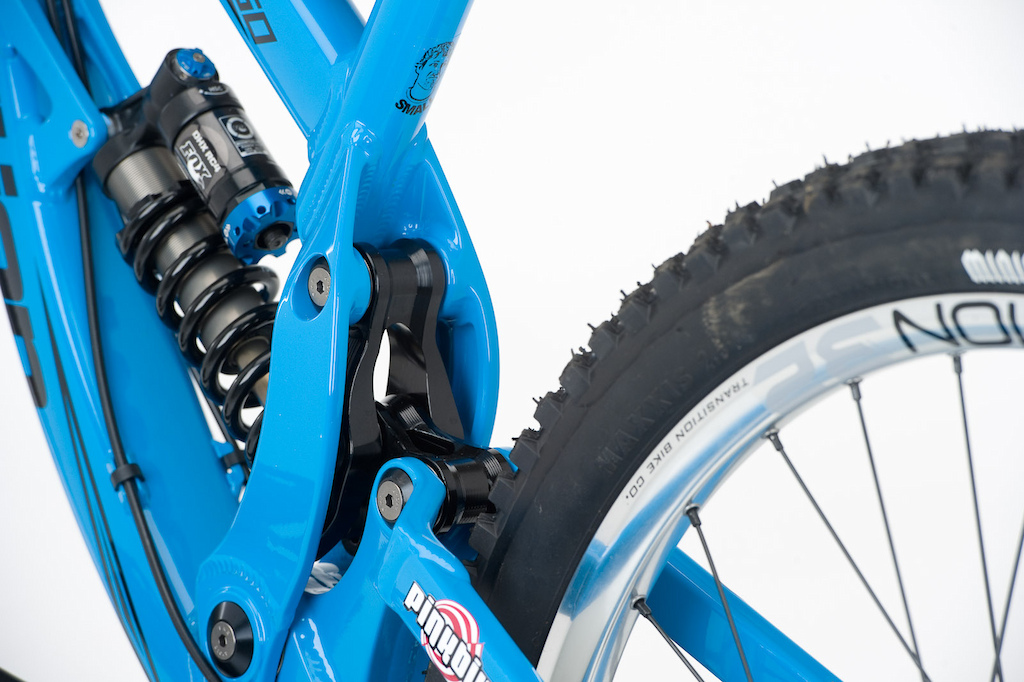 The single pivot swingarm uses a nearly hidden linkage to activate the shock and alter the leverage curve for the bike's intentions - riding hard.